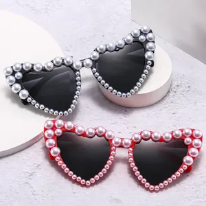 Fashionable heart-shaped sunglasses with elegant pearl embellishments for women