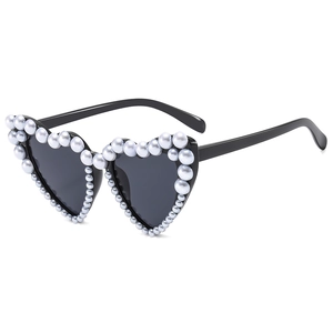 Fashionable heart-shaped sunglasses with pearl accents and black lenses for women