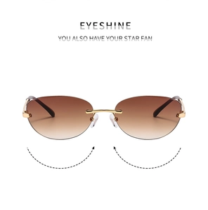 Detail of rimless Y2K sunglasses with gradient brown lenses and gold metal temples