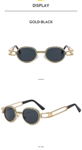 Detail of gold oval sunglasses with rhinestones and hollow chain temples