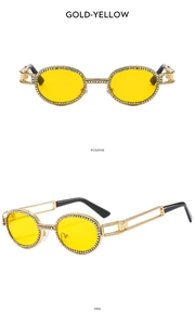 Detail view of punk style oval sunglasses with gold frame and yellow lenses and rhinestones