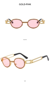 Detail of gold oval sunglasses with pink rhinestones and hollow metal temples