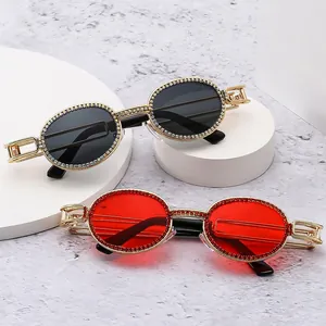 Oval punk sunglasses with diamond accents and hollow metal temples in gold finish