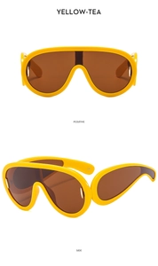 Front and side views of oversized yellow punk goggles with brown shield lenses