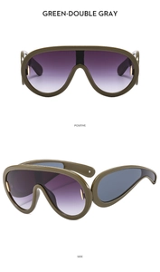 Detail view of green oversized sports sunglasses with purple gradient lenses and gold accents