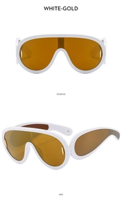 Detail view of white wrap-around sunglasses with wide temples and gold metal accents