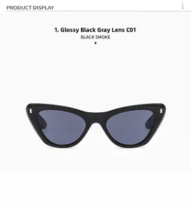 Close-up of cat-eye eyewear showing glossy black frame with silver metal stud details