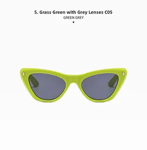 Detailed front view of bright grass green cat eye sunglasses with dark grey lenses