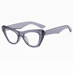 Detailed side view of translucent grey cat-eye glasses frame with silver metal rivets