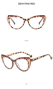 Detail of cat eye glasses frames in demi pink red with tortoiseshell leopard pattern