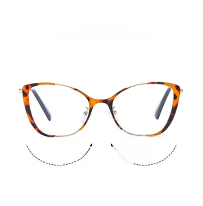 Detail of tortoise shell cat eye glasses with gold metal bridge and blue light lens