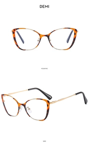 Detail view of cat eye glasses in demi tortoise frame with gold metal temples