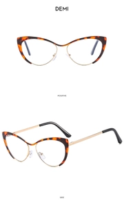 Détail de lunettes yeux de chat demi avec accents en métal doré et double vue