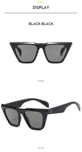 Front and 45-degree side view of black cat eye oversized sunglasses with silver rivets