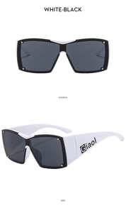 Macro detail of Y2K square sports sunglasses in white and black contrast frames