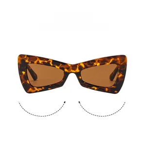 Macro view of butterfly cat-eye sunglasses with tortoiseshell frame and brown lenses