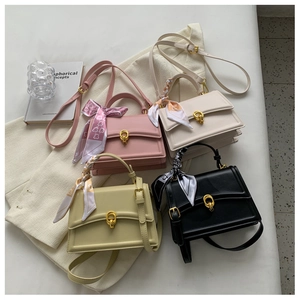 Top view of leather flap crossbody bags in four colors with scarf-wrapped handles
