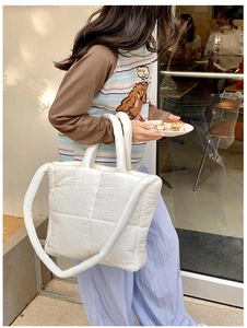 White quilted puffer tote bag for women, soft cloud shoulder bag with large casual capacity style.