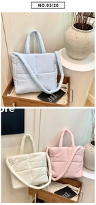 Detailed view of the quilted puffer tote bag, soft cloud handbag with spacious design.