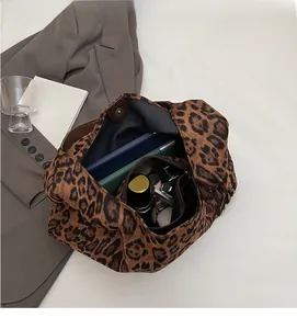 Top view of large leopard canvas tote bag with a removable black zipper inner pouch
