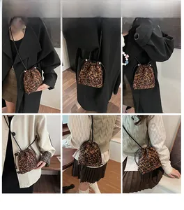 Leopard print drawstring bucket bag shown in six different styling and carrying options
