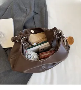 Brown faux leather tote bag interior showing large capacity for umbrella and wallet