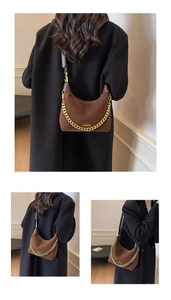 Detail of hobo handbag with golden chain strap and dark coffee suede leather finish