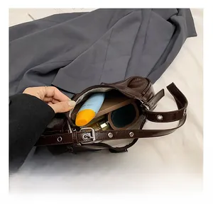 Macro view of brown leather bag interior showing capacity for daily essentials