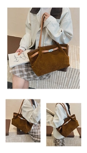 Detail view of the brown suede bucket bag with leather handles and silver buckle closure