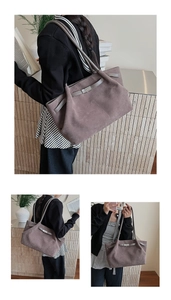 Detail view of a suede tote bag in mauve with adjustable strap and buckle closure