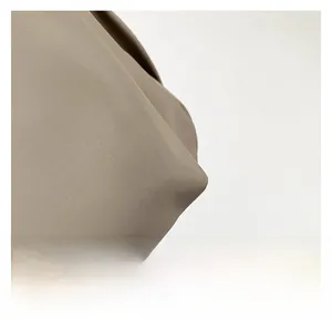 Close-up of khaki twill fabric texture showing high-quality woven material details