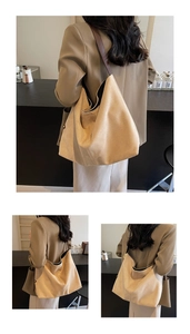 Detail of minimalist suede shoulder bag showing soft texture and large capacity