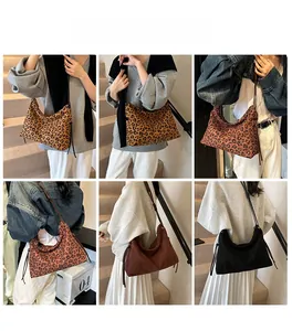 Detail showing various leopard print and solid color tote bags with tassel accents