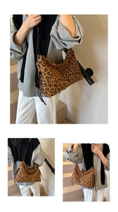 Detail of vintage leopard print tote bag with stylish side drawstring tassels and black strap