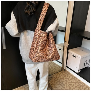 Detail of leopard print tote bag showing large capacity and wide shoulder strap