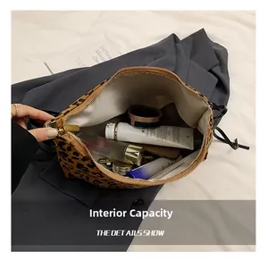 Internal capacity detail showing skincare products inside leopard print cosmetic bag