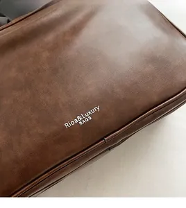 Close-up of premium brown faux leather texture with Rioa & Luxury brand logo detail