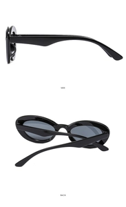 Side and back view of oval cat-eye sunglasses with sleek black frame and dark lenses