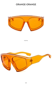 Orange oversized Y2K sports sunglasses with white stripe top trim in front and side views