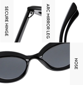 Detailed view of secure metal hinges and arc mirror legs on black cat eye sunglasses