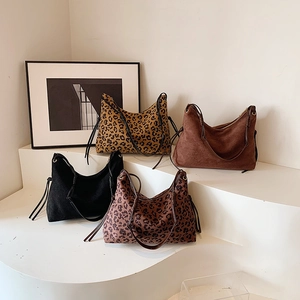 Minimalist leopard print and solid hobo bags with knotted straps in four colors