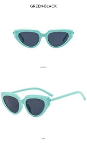 Front and side view of trendy mint green cat eye sunglasses with black lenses