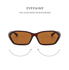 Detailed front view of Y2K sunglasses with dark brown frames and orange lenses