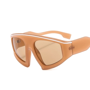 Futuristic large-frame Y2K oversized sunglasses with amber translucent finish