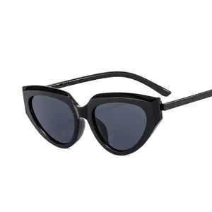 Classic black cat-eye sunglasses with geometric frames and dark tinted lenses