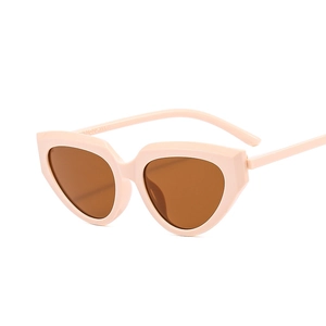 Peach cat eye sunglasses with brown lenses and chunky frames for stylish women