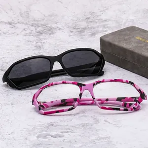 Y2K millennial style sunglasses in black and pink camo frame on marble background
