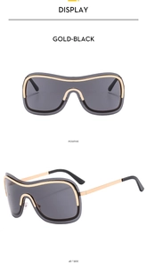 Front- und 45-Grad-Seitenansicht der gold-schwarzen rahmenlosen Y2K-Wickelsonnenbrille