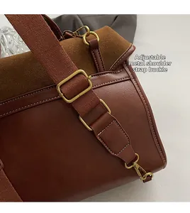 Close-up of durable golden metal buckle and adjustable strap on retro brown backpack