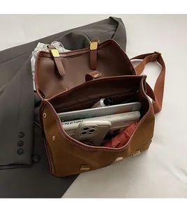 Top view showing the large capacity and internal compartments of the brown retro backpack
